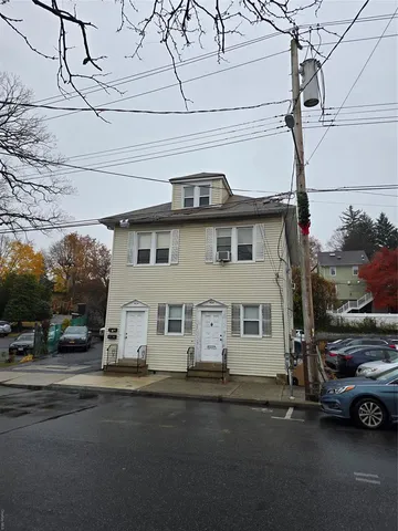 a view of a street with cars