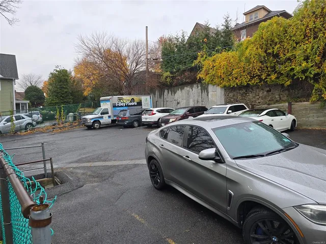 a view of a cars parked in front of a house