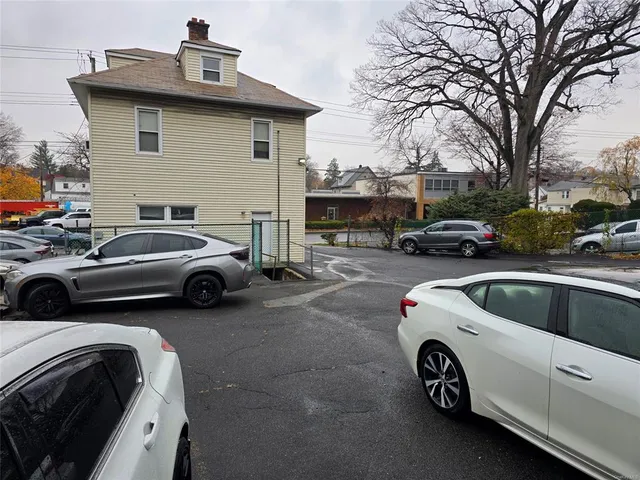 a view of a car parked in front of a house