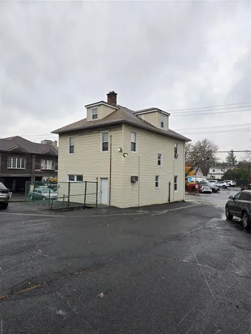 a view of street with parked cars