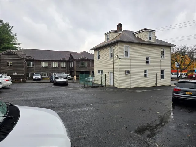 a view of street with parked cars
