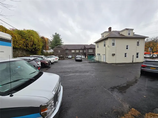 a view of a cars park in front of house