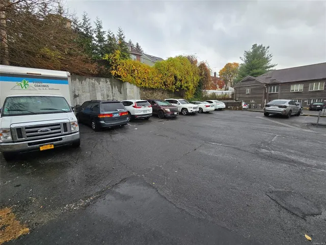 a view of street with parked cars