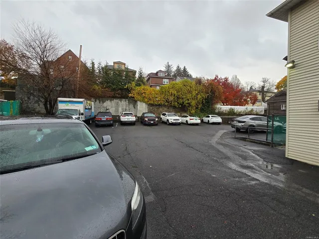 a view of street with parked cars