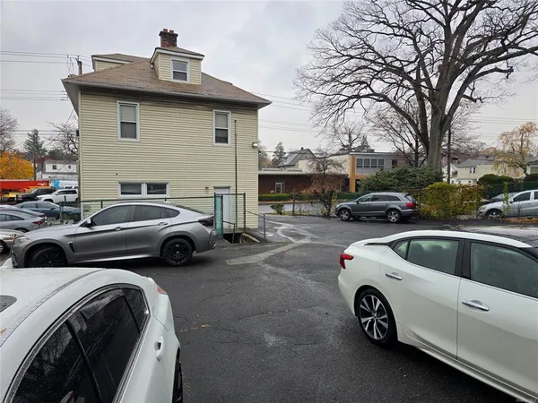 a view of a cars park in front of house