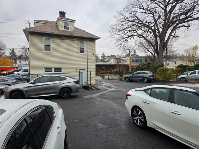 a view of a cars park in front of house