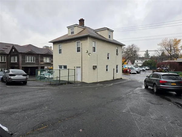 a view of street with parked cars
