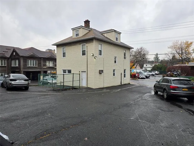 a view of street with parked cars
