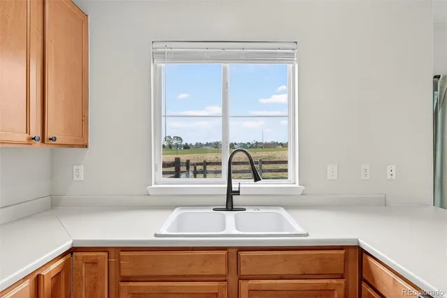 a kitchen with a sink and a window