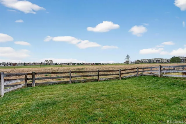 a view of a yard with an outdoor seating