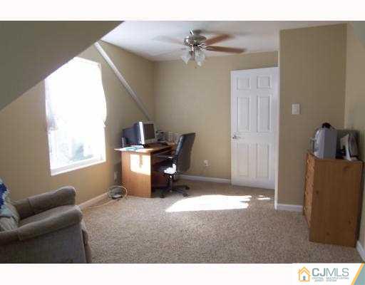 27 Dover Road Colonia, NJ 07067 - Photo 8 of 10 a room with furniture and a window