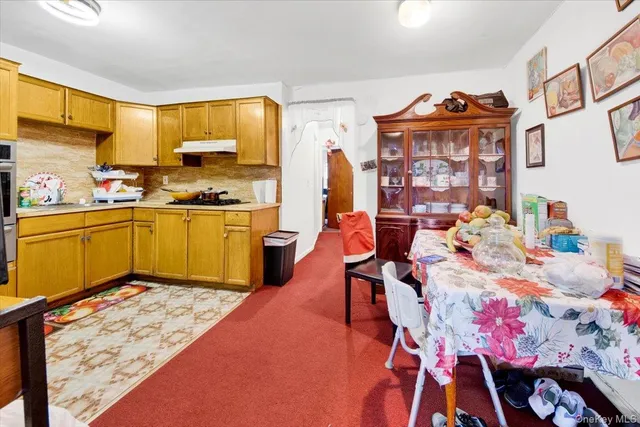 a bed room with a bed and a dresser in it