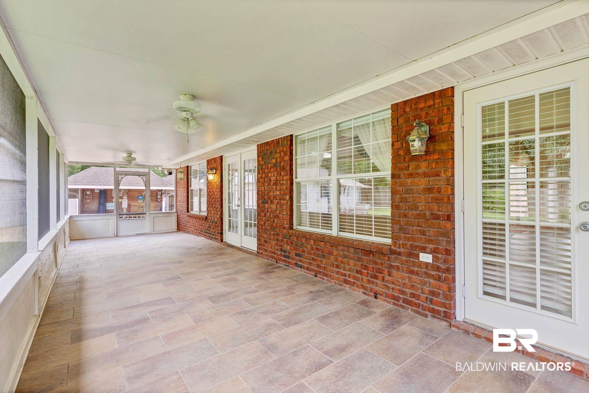 329 Collinwood Loop Foley, AL 36535 - Photo 27 of 35 Unfurnished sunroom with ceiling fan and french doors