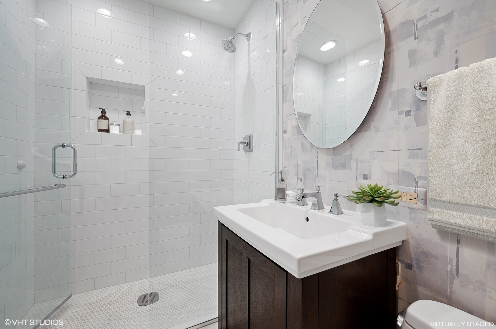 237 East Delaware Place, Unit 2A Chicago, IL 60611 - Photo 14 of 19 a bathroom with a sink a toilet and shower