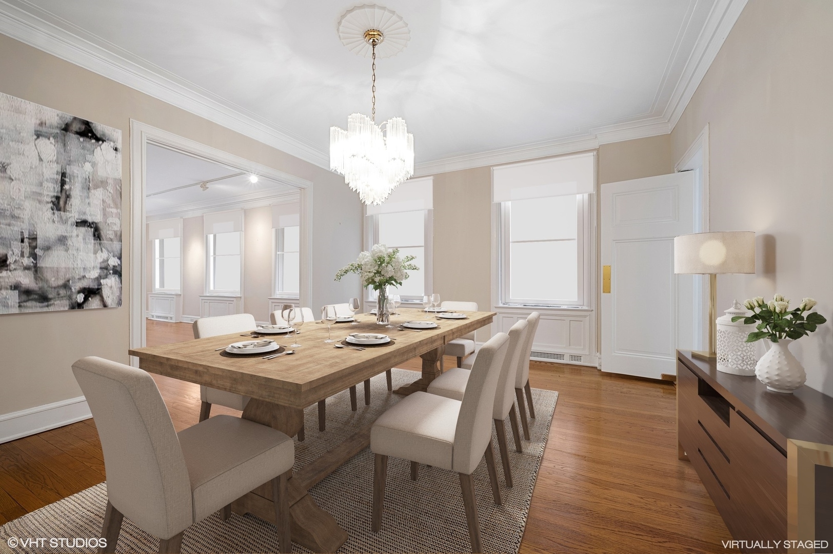 237 East Delaware Place, Unit 2A Chicago, IL 60611 - Photo 6 of 19 a view of a dining room with furniture wooden floor and chandelier