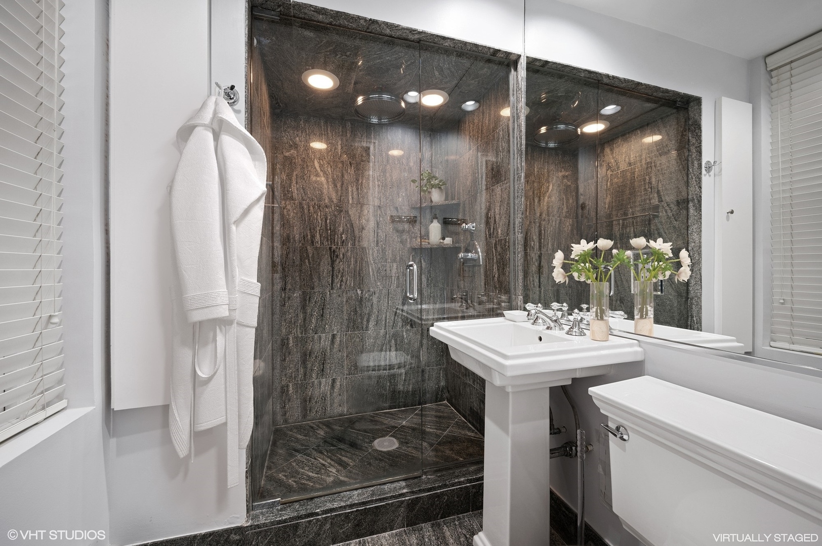 237 East Delaware Place, Unit 2A Chicago, IL 60611 - Photo 9 of 19 a bathroom with a sink shower and a mirror