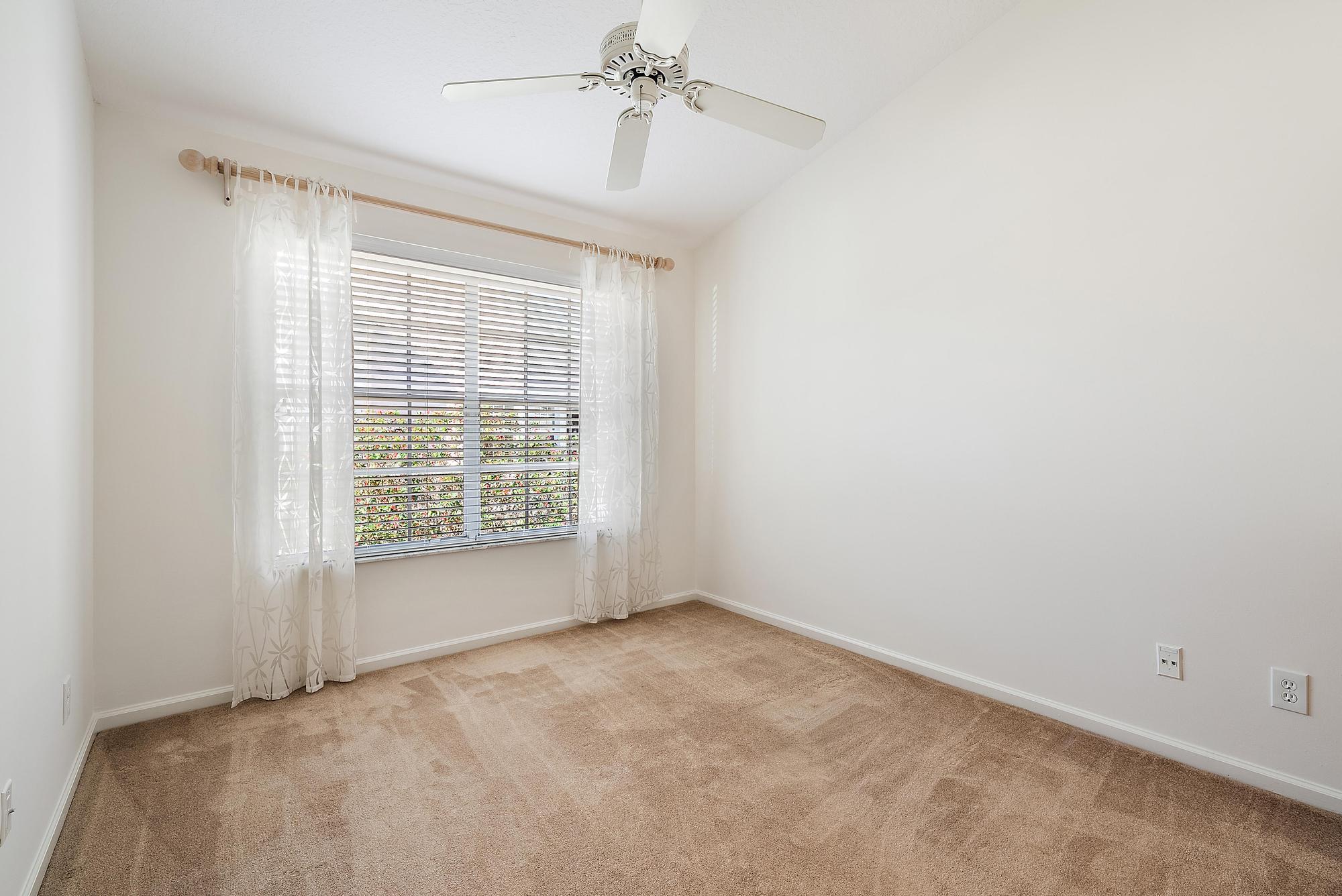 802 Muirfield Court, Unit 802A Jupiter, FL 33458 - Photo 14 of 25 a view of an empty room with a window