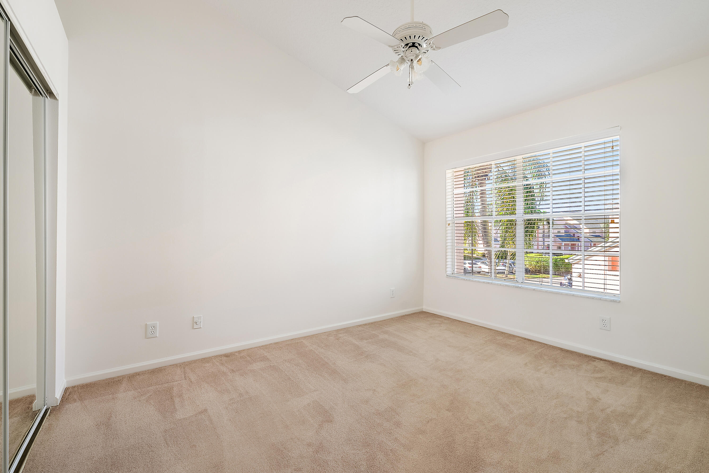 802 Muirfield Court, Unit 802A Jupiter, FL 33458 - Photo 16 of 25 an empty room with a window