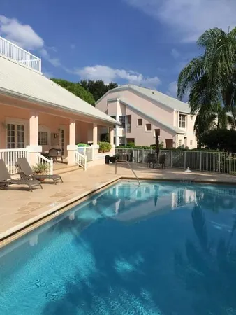 a swimming pool view with a outdoor seating