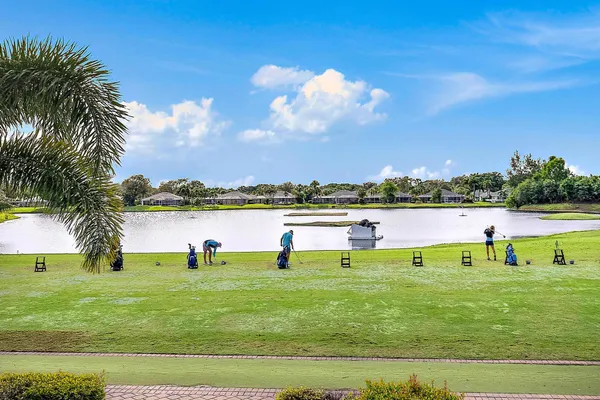 a view of a lake with houses in the back