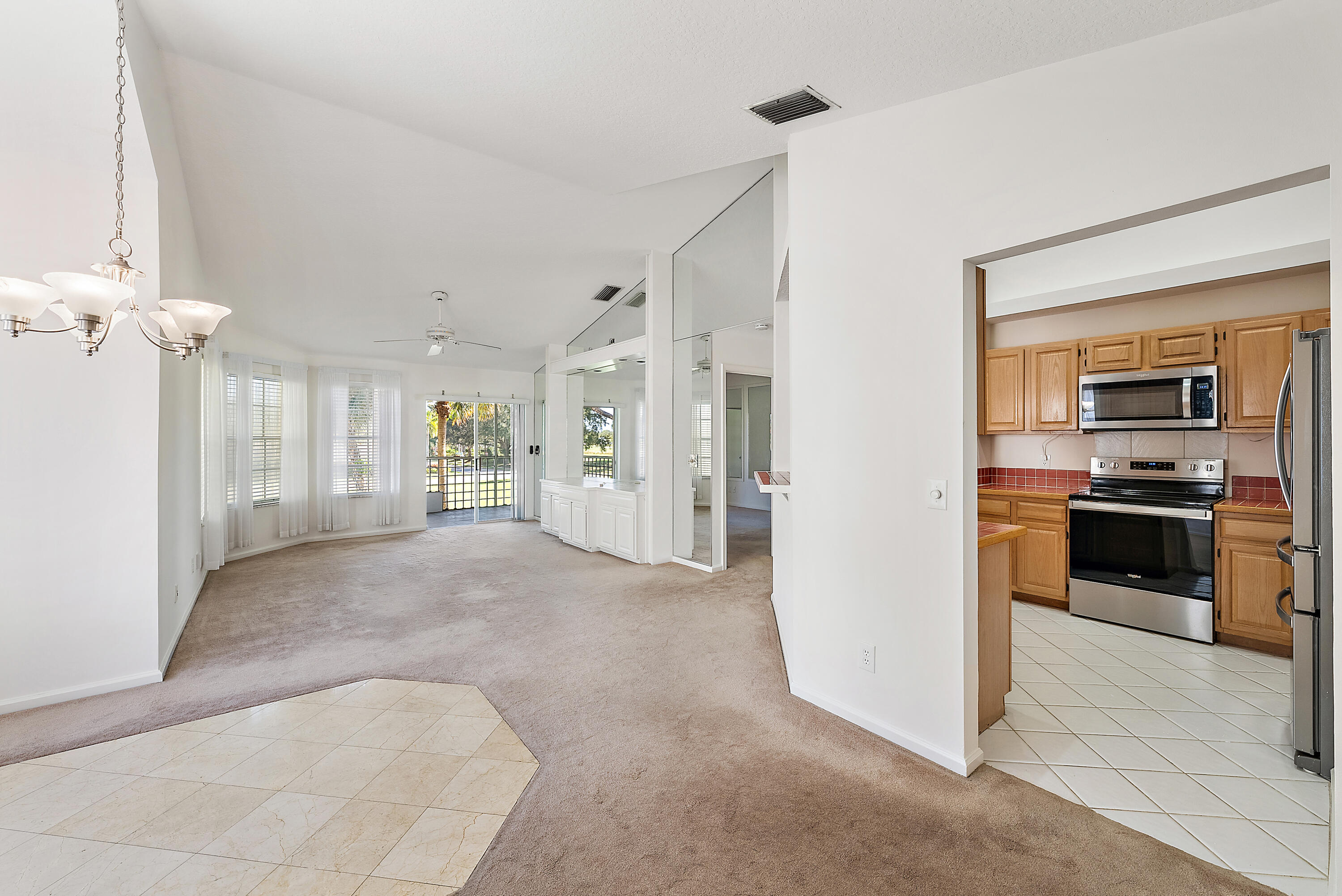 802 Muirfield Court, Unit 802A Jupiter, FL 33458 - Photo 6 of 25 a view of a kitchen with a sink