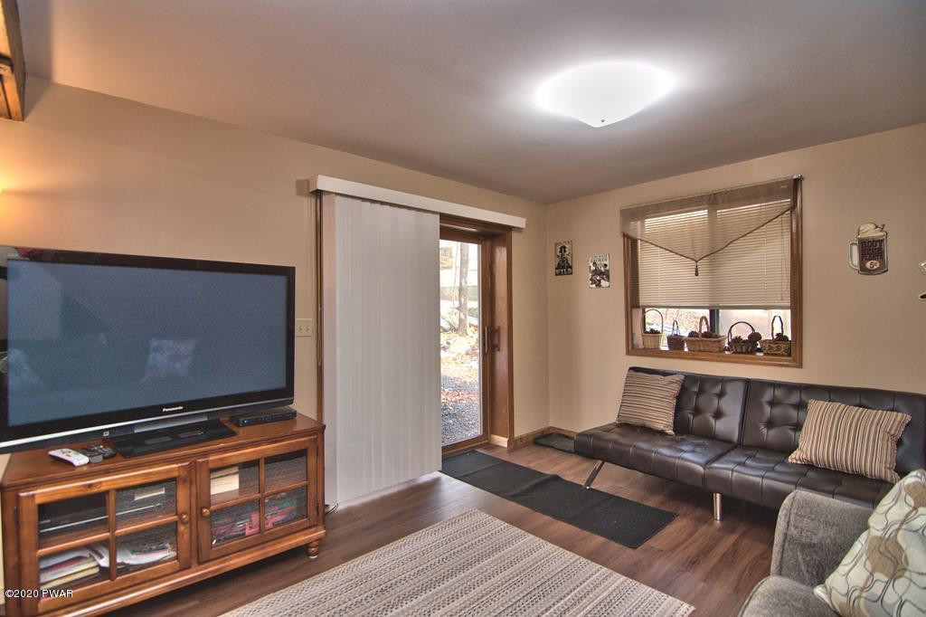 27-2690 Boulder Road Lake Ariel, PA 18436 - Photo 37 of 48 a living room with furniture and a flat screen tv