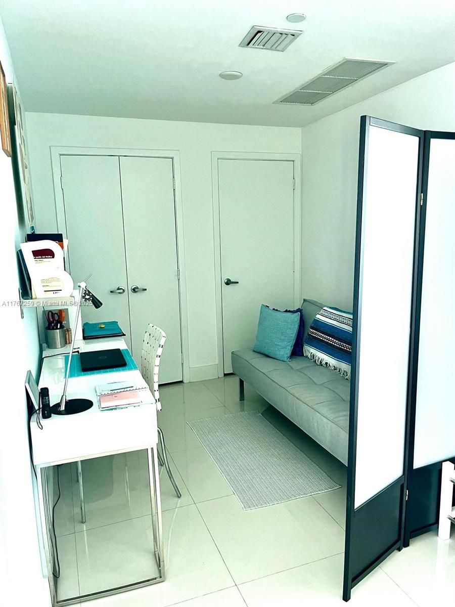 888 Biscayne Boulevard, Unit 4306 Miami, FL 33132 - Photo 37 of 70 a living room with furniture and a table