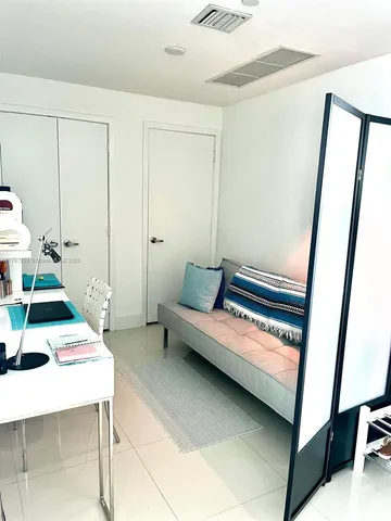 a living room with fireplace furniture and a flat screen tv