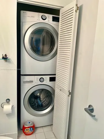 a view of a patio with table and chairs and potted plants