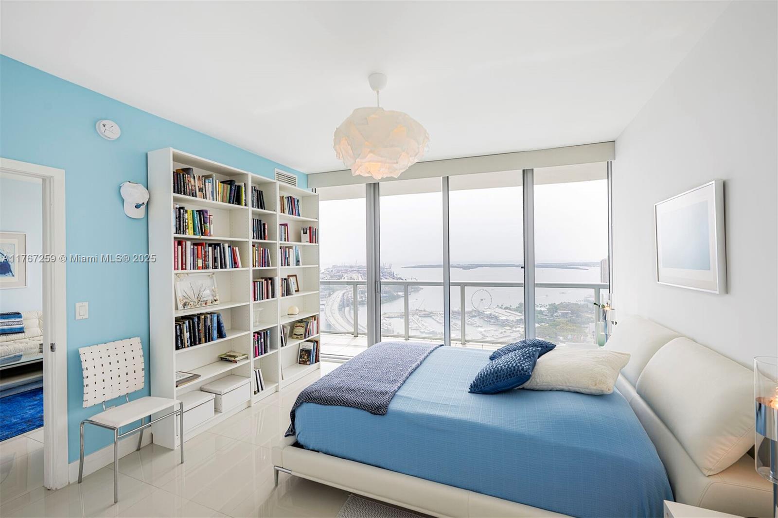 888 Biscayne Boulevard, Unit 4306 Miami, FL 33132 - Photo 5 of 70 a bedroom with a bed furniture and a large window