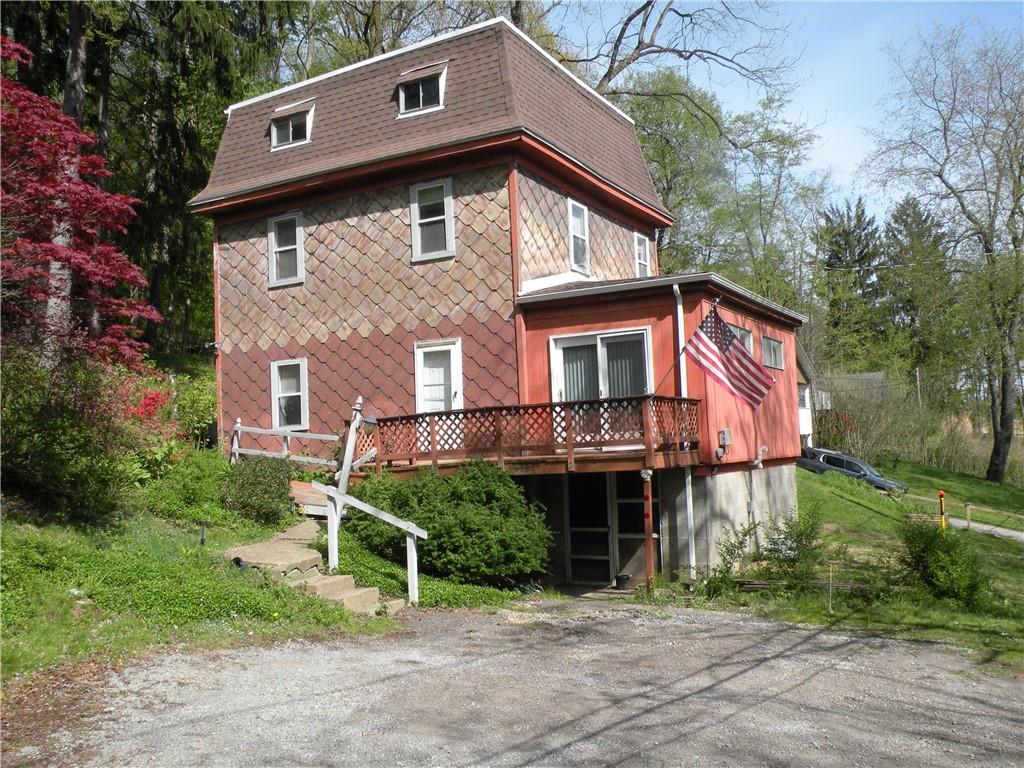 119 Upper Arrowhead Road Pittsburgh, PA 15237 - Photo 1 of 10 a front view of a house with a garden