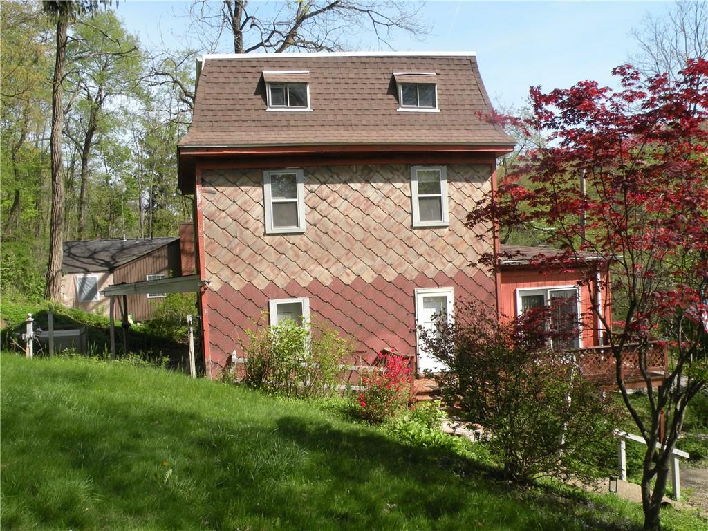 119 Upper Arrowhead Road Pittsburgh, PA 15237 - Photo 2 of 10 a front view of a house with a garden