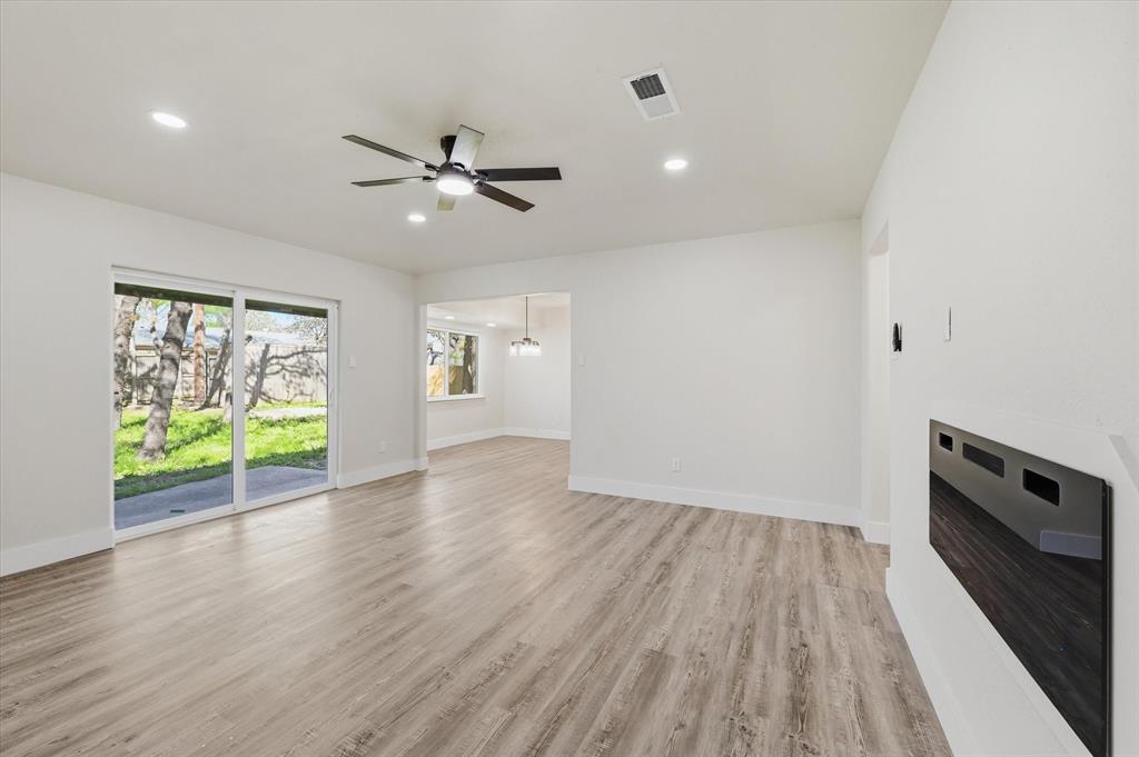 2804 Bent Tree Lane Arlington, TX 76016 - Photo 17 of 32 wooden floor in an empty room with a window