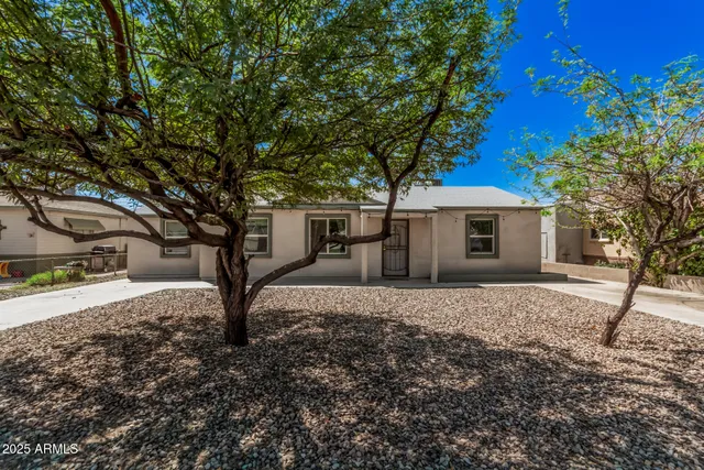 a house with trees in front of it