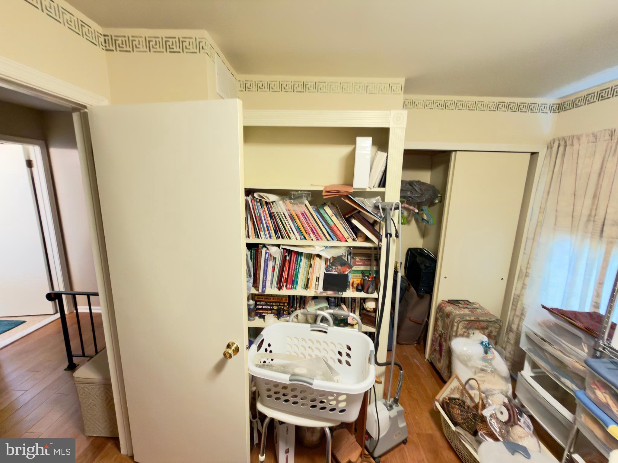 2548 Nashua Road Bensalem, PA 19020 - Photo 12 of 15 a view of a hallway with furniture and a book shelf