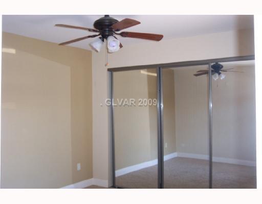 8101 West Flamingo Road, Unit 2092 Las Vegas, NV 89147 - Photo 5 of 9 Master Bedroom. Master bedroom with bath, miirrored closet doors and ceiling fan