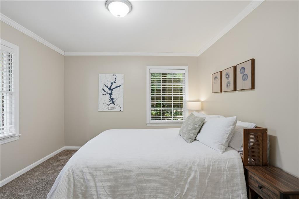 4000 Lower Roswell Road Marietta, GA 30068 - Photo 20 of 25 a bedroom with a large bed and a window