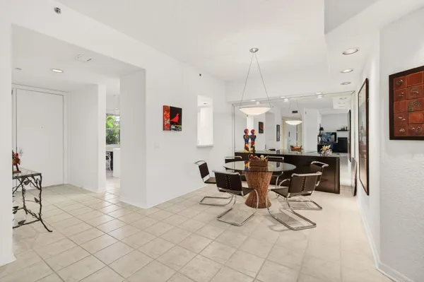 a living room with furniture and large windows