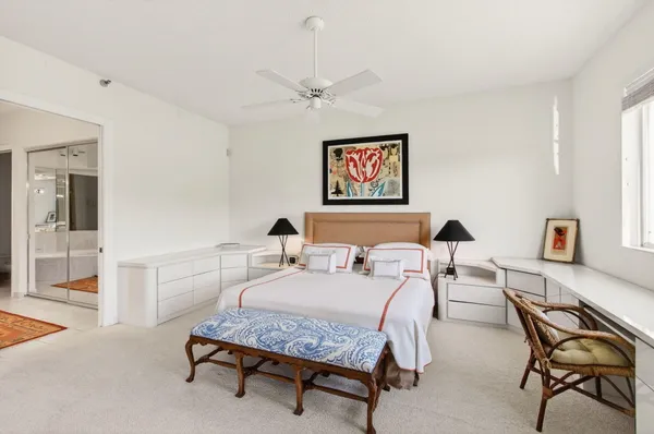 a bathroom with a sink toilet vanity and shower