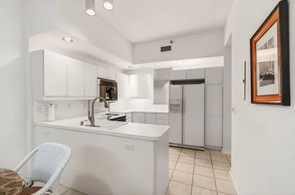 a view of a livingroom with furniture and a flat screen tv