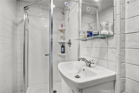 a bathroom with a sink toilet and mirror