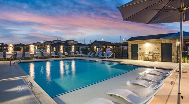 a view of a patio with swimming pool