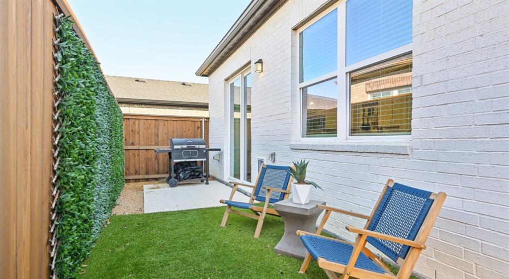 3950 Dechman Drive, Unit 2015 Grand Prairie, TX 75052 - Photo 12 of 27 a backyard of a house with outdoor seating