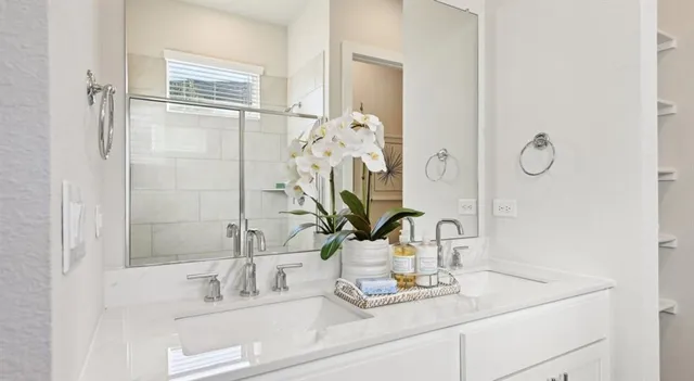 a kitchen with refrigerator cabinets and wooden floor