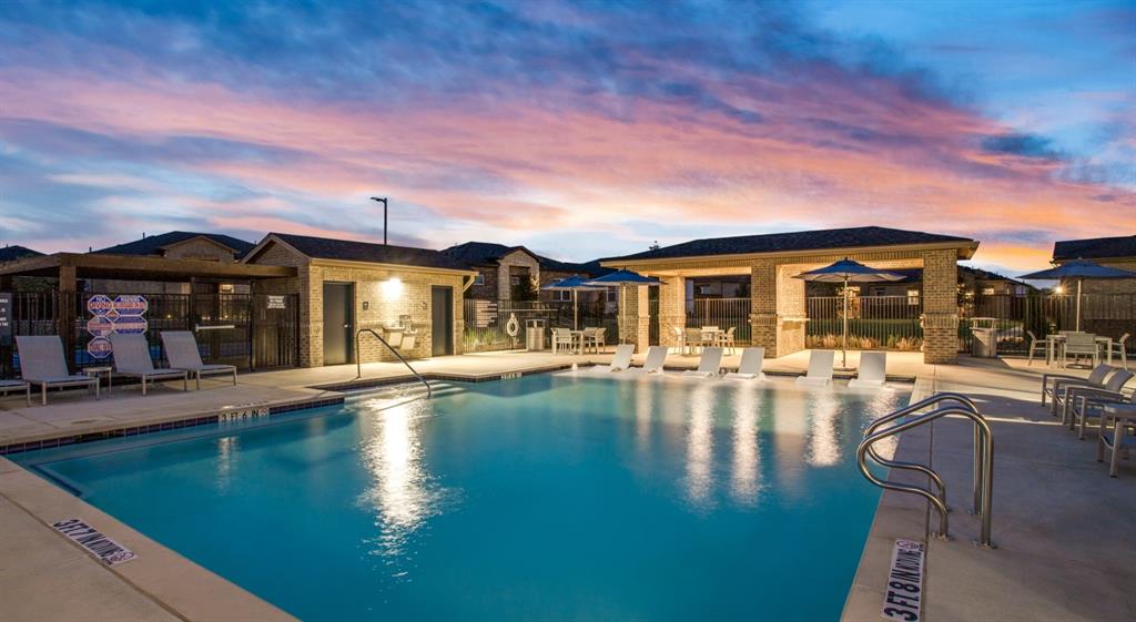 3950 Dechman Drive, Unit 2015 Grand Prairie, TX 75052 - Photo 3 of 27 a view of a house with swimming pool and sitting area
