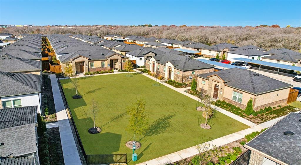 3950 Dechman Drive, Unit 2015 Grand Prairie, TX 75052 - Photo 7 of 27 an aerial view of residential houses with outdoor space