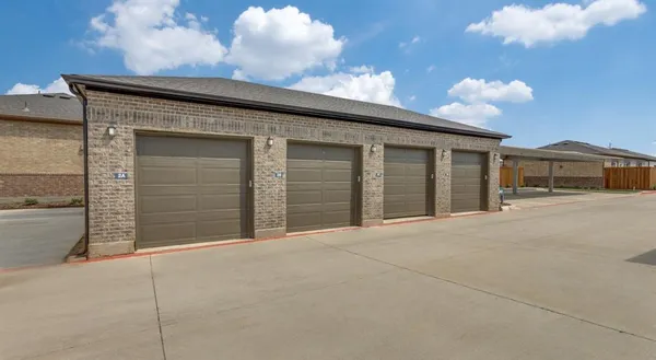 a front view of a house with a garage