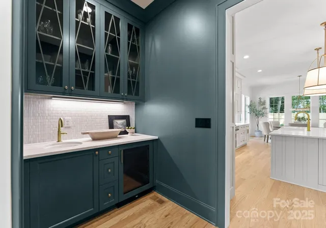 a kitchen with a sink and a refrigerator