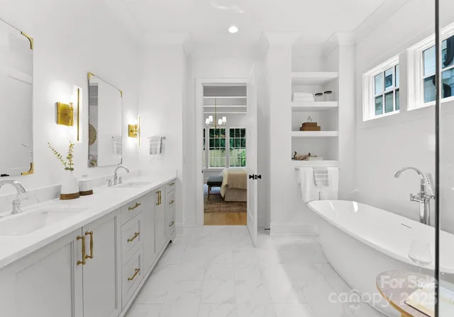a spacious bathroom with a tub sink and mirror
