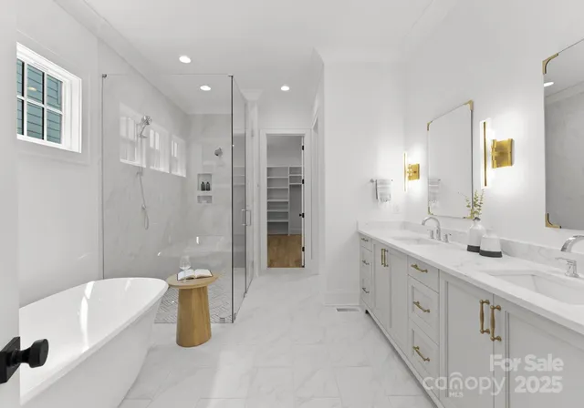 a spacious bathroom with a tub sink shower and mirror